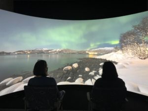People viewing the immersion room screen