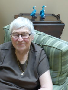 Photo of private care client Carole Ward relaxing at home.